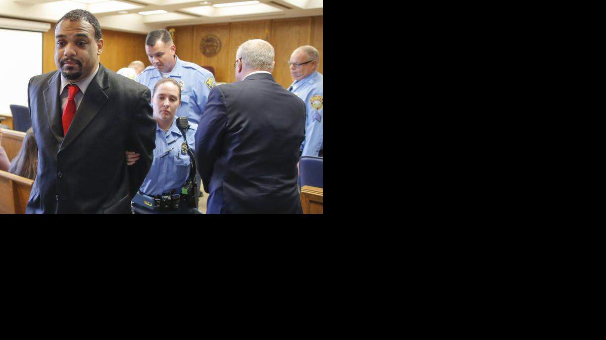 
Antwon Banks is led from a Sedgwick County courtroom in handcuffs after he was found guilty of first degree murder in the death of Daniel Flores. Flores was found dead in the basement of a Steckline Communication office at 1632 S. Maize Road on Feb. 9, 2014. 
