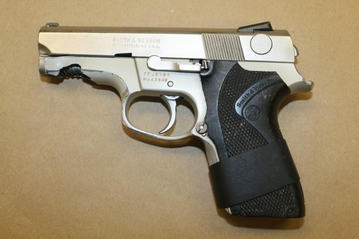This Smith and Wesson handgun was recovered from the crime scene. Police say an officer’s round struck the gun slightly below its barrel.