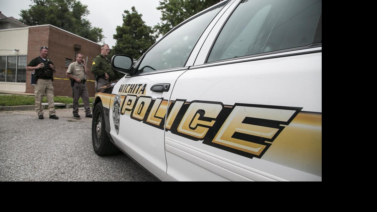 
Wichita police investigate the scene of a shooting at Douglas and Estelle on Wednesday. A man was found in the street suffering from gunshot wounds shortly before 3 a.m. Wednesday. He was later pronounced dead at a local hospital. (July 8, 2015)
