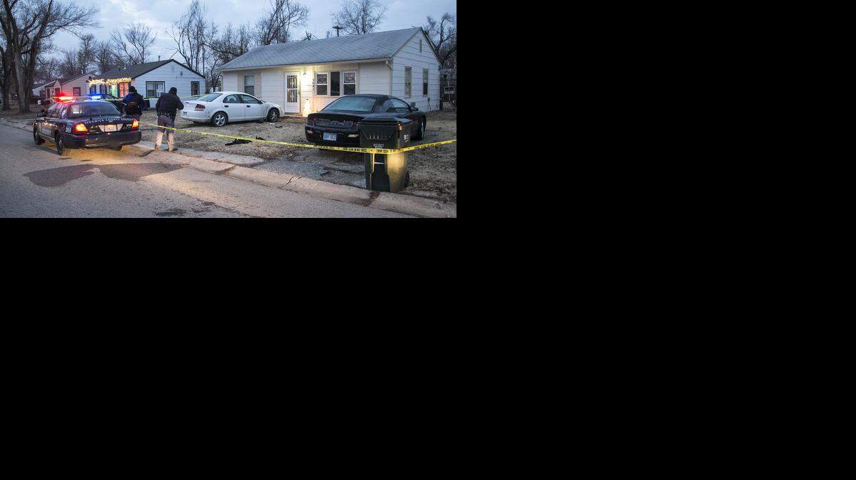 
Sedgwick County sheriff’s deputies investigate the scene of a fatal shooting at 5041 S. Elmhurst Wednesday morning. (Dec. 10, 2014) 
