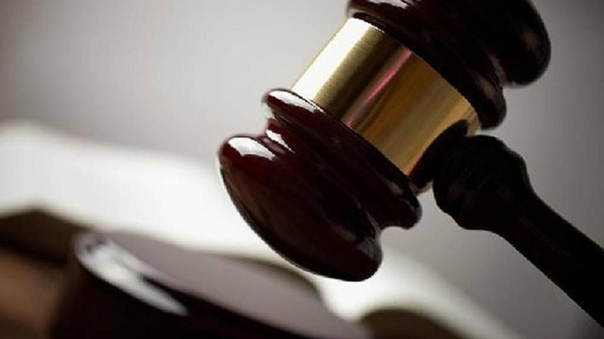A former Lawrence police officer is accused of beating a fellow officer and locking her in a dog kennel, according to court documents in a federal lawsuit. The former officer, Jacob W. Burke, has sued the city, claiming his arrest was unlawful.