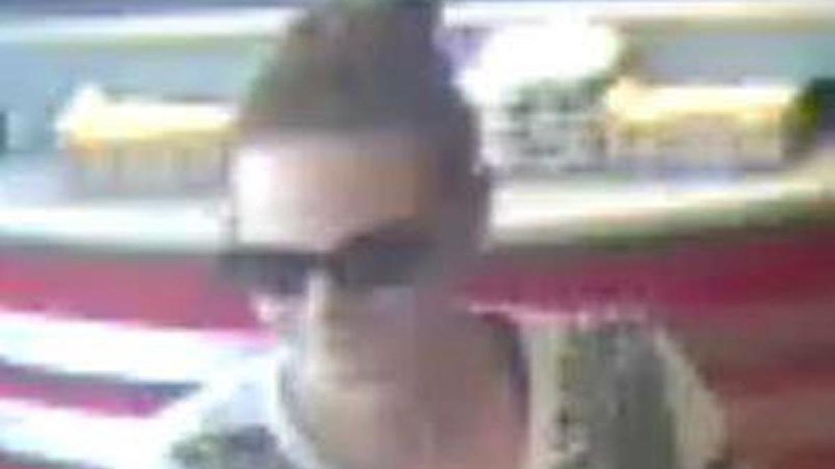 This woman is a person of interest in a purse snatching at Pawnee Prairie Park, police say.