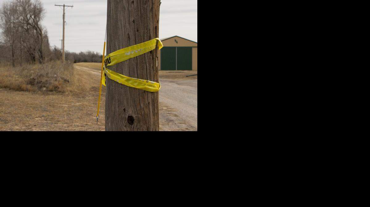 
Crime scene tape is wrapped along a driveway leading to a home outside of which a man was fatally shot Dec. 29 near Haysville. 
