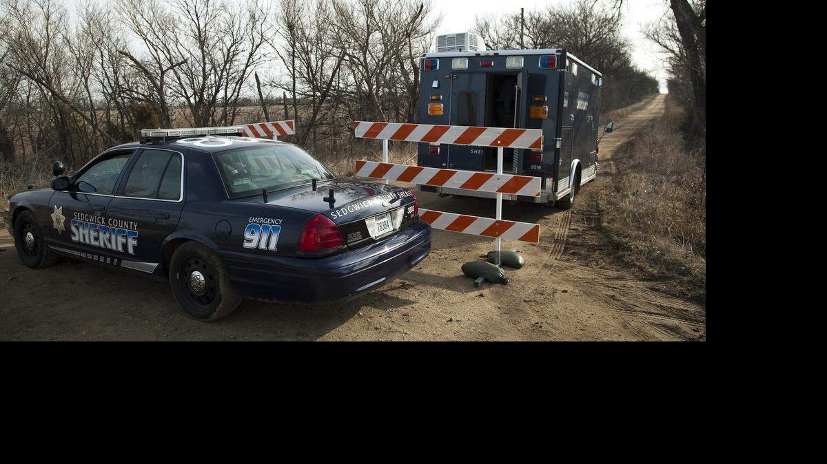 
A Sedgwick County sheriff’s mobile command truck sits at the scene of a shootout on Northwest 70th Street, in Butler County, southeast of Potwin, on March 11, 2013. 
