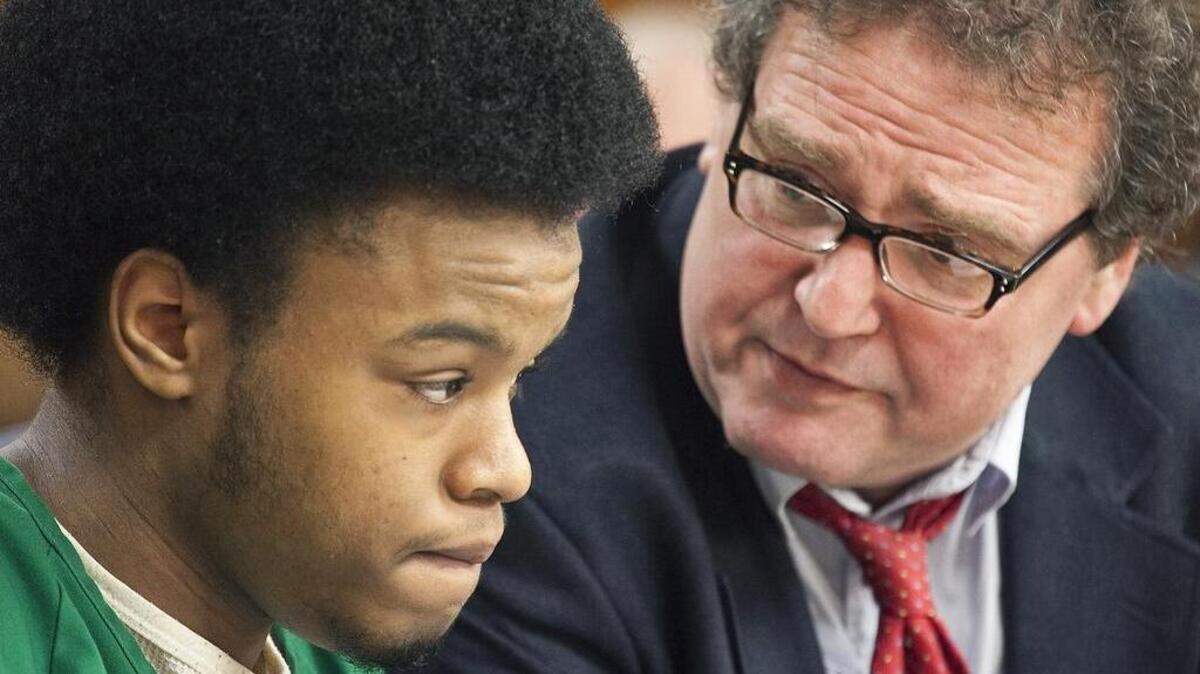 Marquis Marshall, left, with defense attorney Ron Evans, attends a 2013 preliminary hearing for his capital murder trial in a double homicide that occurred at a Dollar General store on 13th Street near Oliver in November 2012. (May 2, 2013)