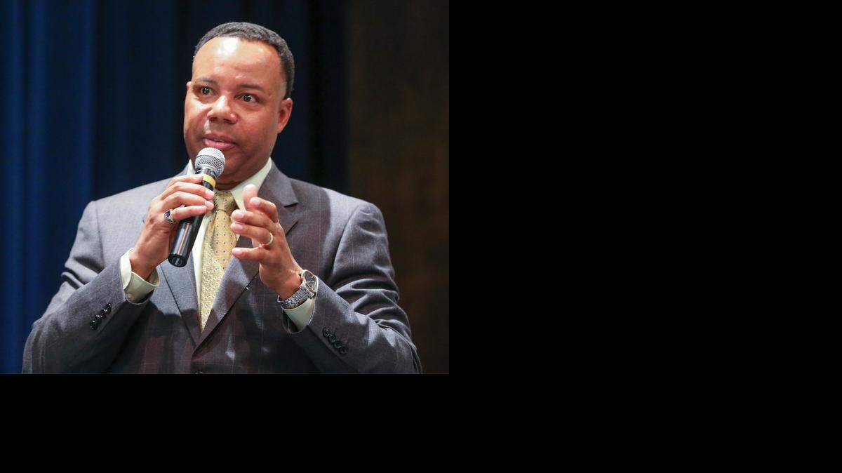 
Kevass Harding, pastor at Dellrose United Methodist Church and a former Wichita police officer, addresses the crowd during a community meeting Thursday at East High School to discuss police/community relations. (Aug. 28, 2014)
