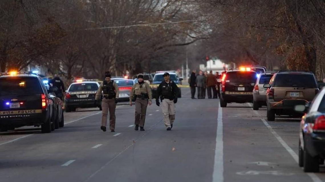 Wichita police search the area near 18th and Market after a deadly shooting Monday afternoon.