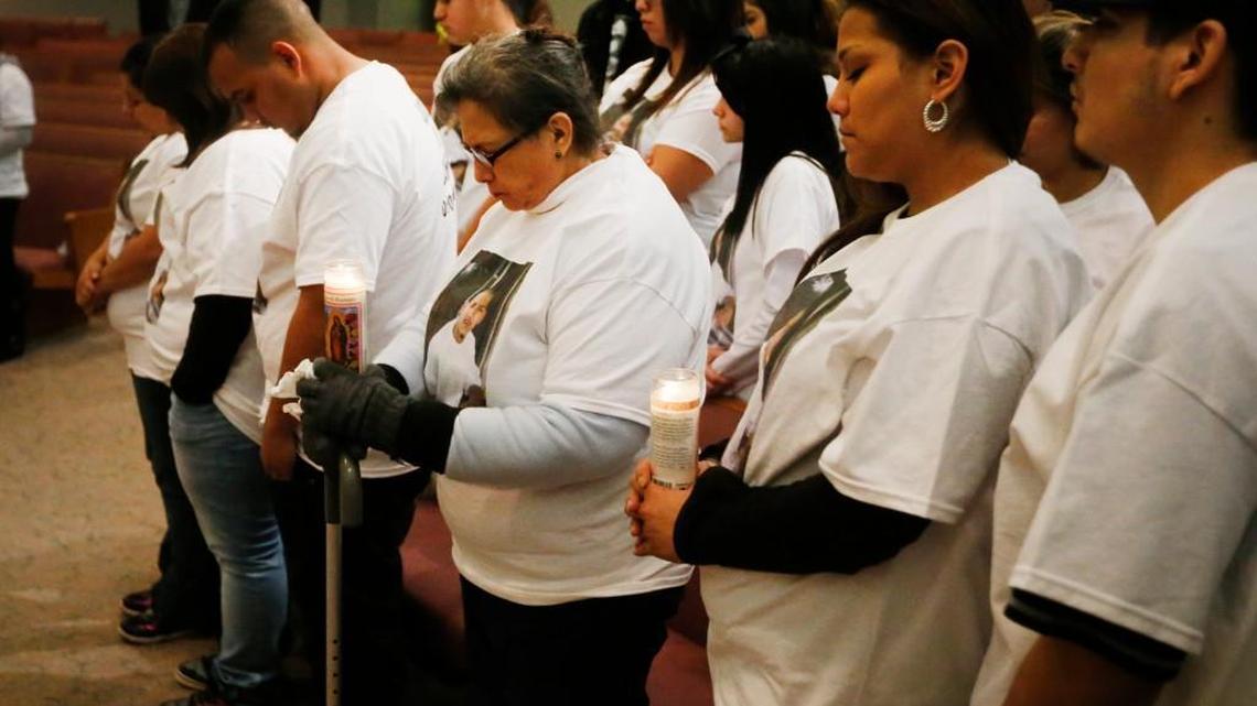 
Relatives of John Paul Quintero stand for a moment of silence. (Jan. 7, 2015)
