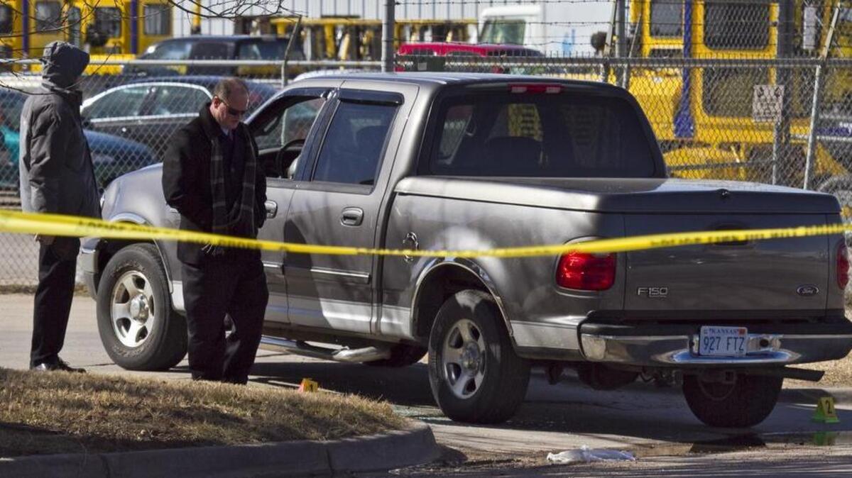 Wichita Police investigate the scene where an employee was found shot in the parking lot of Santana Concrete, 3665 W. McCormick. The man, in his 40s, was found about 7 a.m., still alive, in a vehicle at the business at 3665 W. McCormick, a few blocks east of West Street, police Lt. Doug Nolte said. He died about 7:52 a.m. after being taken to Via Christi Hospital St. Francis. (Feb.21, 2014)