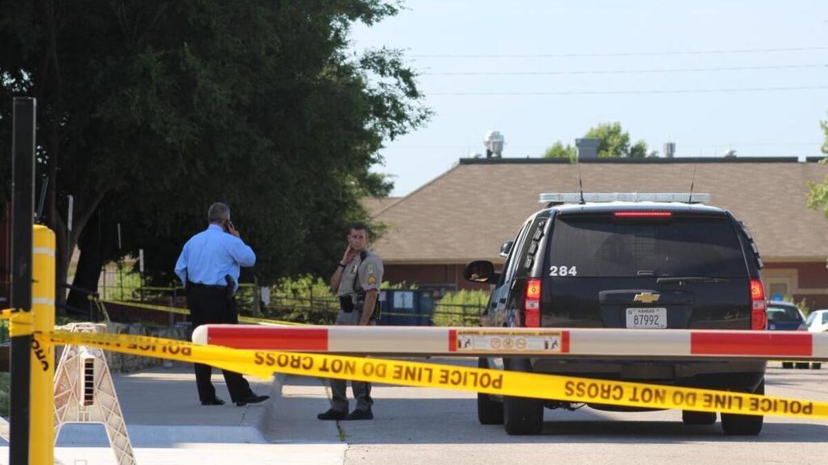 
Wichita police investigate a homicide Saturday morning in the parking lot of the Fairmount Towers dormitory on Wichita State’s campus. 
