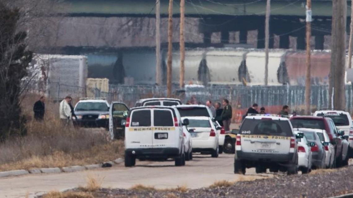 Police surround a scene on north 29th Street, west of Hillside, where a body was found in 2013. (Jan. 16, 2013)