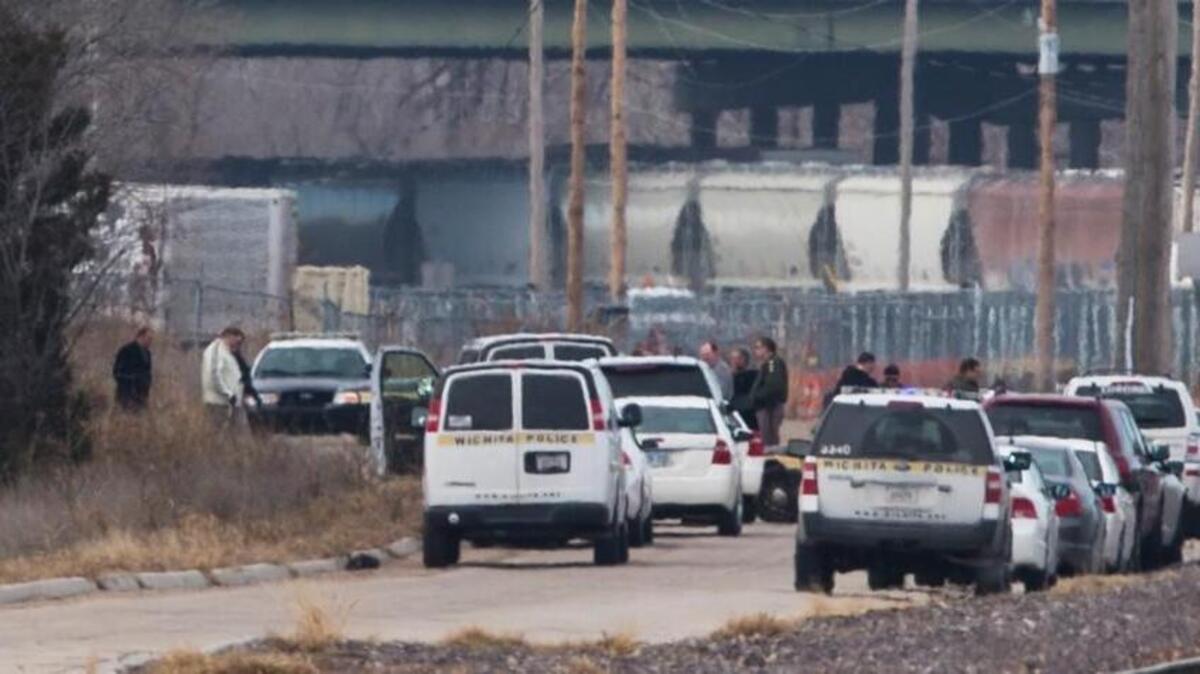 Police surround a scene on north 29th Street, west of Hillside, where a body was found in 2013. (Jan. 16, 2013)