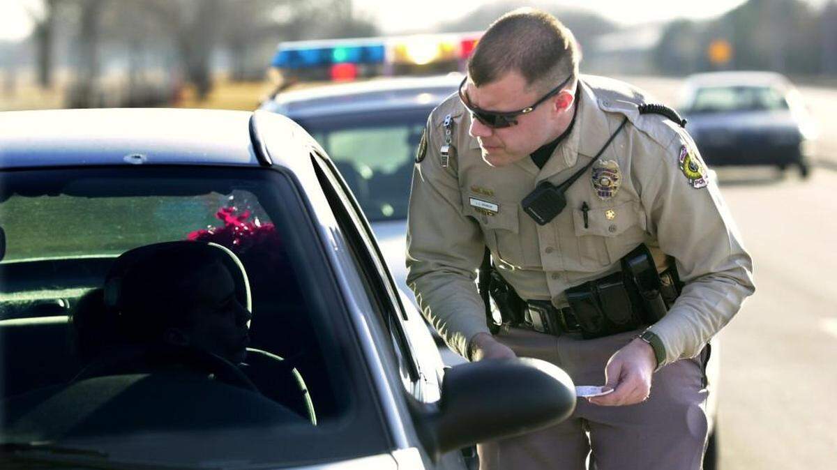 A Wichita police officer issues a ticket in this file photo