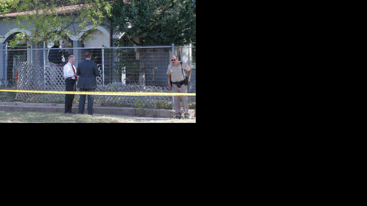 
Wichita Police detectives work outside of a home on South Ida Thursday morning where a couple was found dead in their home.
