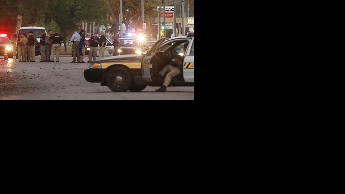 
Police officers investigate a shooting that took place near Douglas and Meridian. (Oct. 26, 2014)
