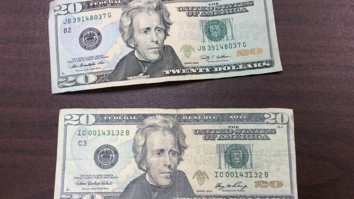 It can be difficult to spot the differences between real and counterfeit cash. The top bill is authentic. The bottom is fake. (May 12, 2016)