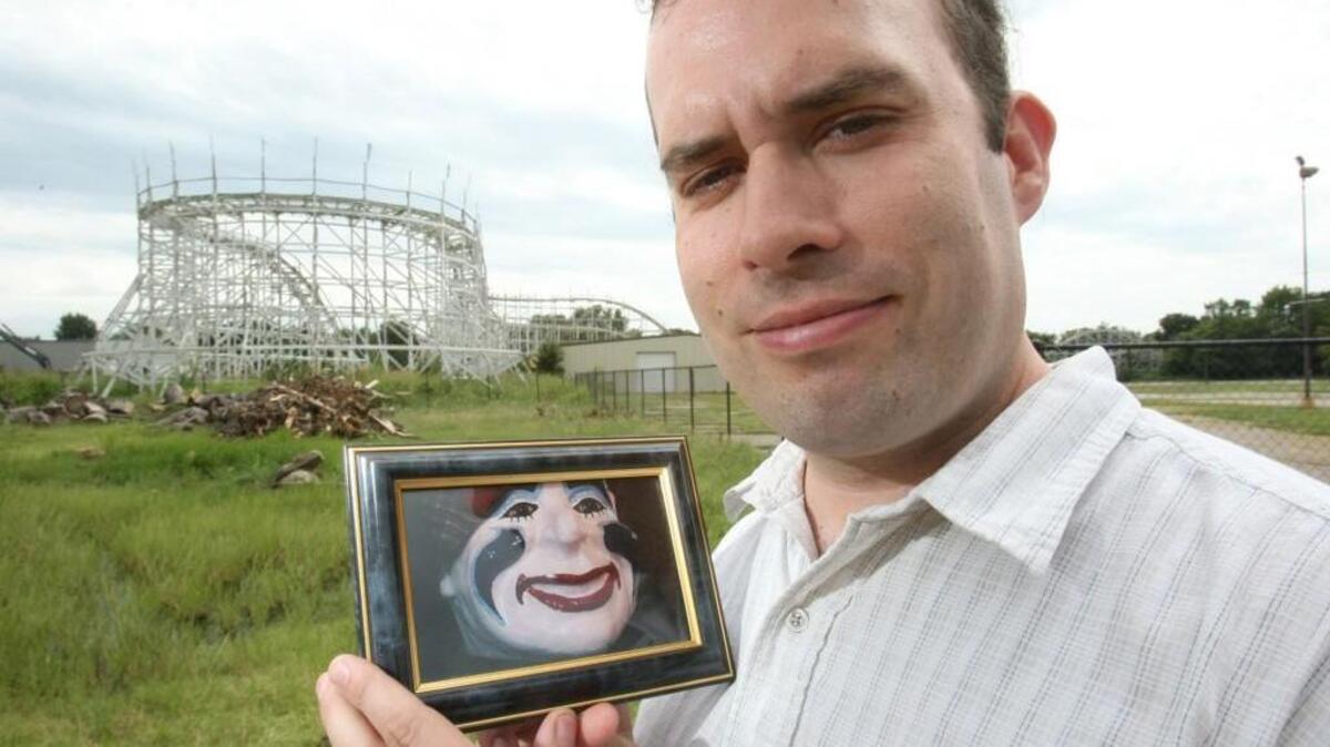 Former Joyland employee Damian Mayes holds a picture of Louie in 2008. (File photo)