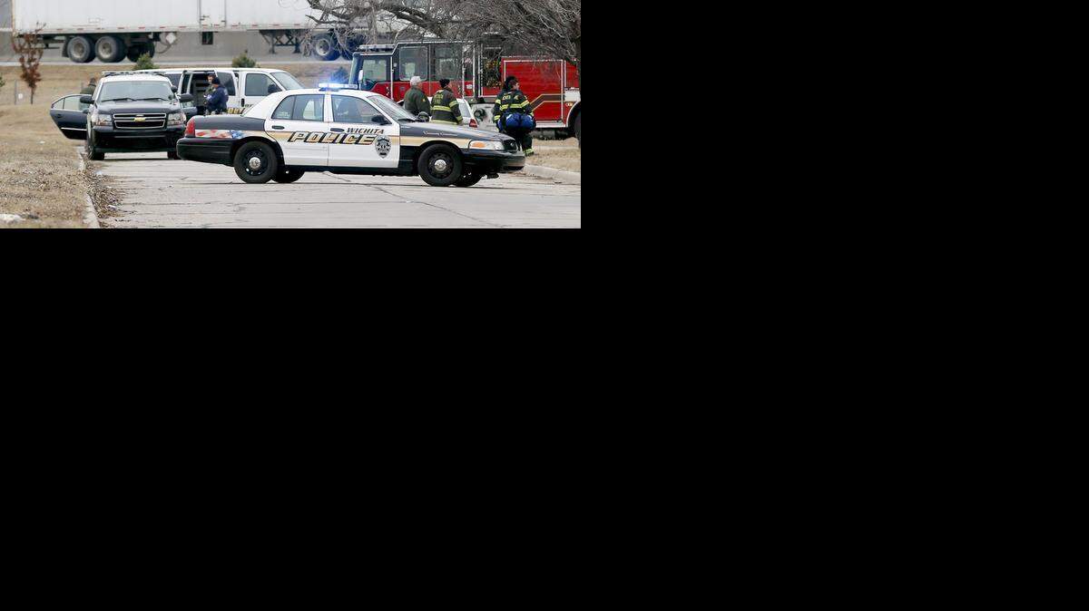 
Police investigate a car, where the body of Sabryna Guerrero-Newman was found Friday just west of Hydraulic and 19th Street. (Jan. 30, 2015)
