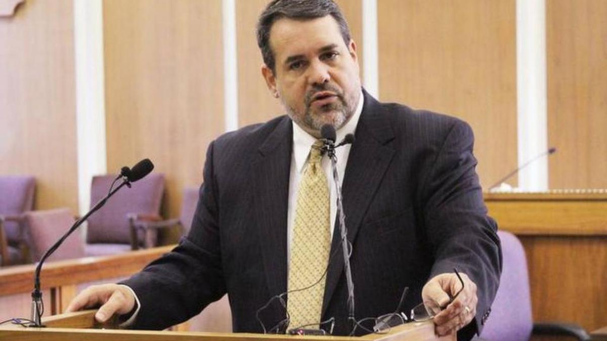 Chris Smith, Cowley County attorney, speaks at a news conference about a fatal shooting that involved a Cowley County sheriff’s deputy in May. (2014)
