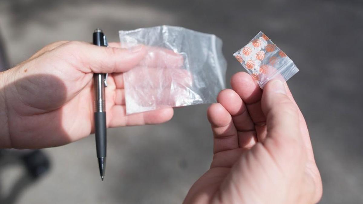 File photo: A Wichita officer holds two bags of what police suspect is methamphetamine in 2016.