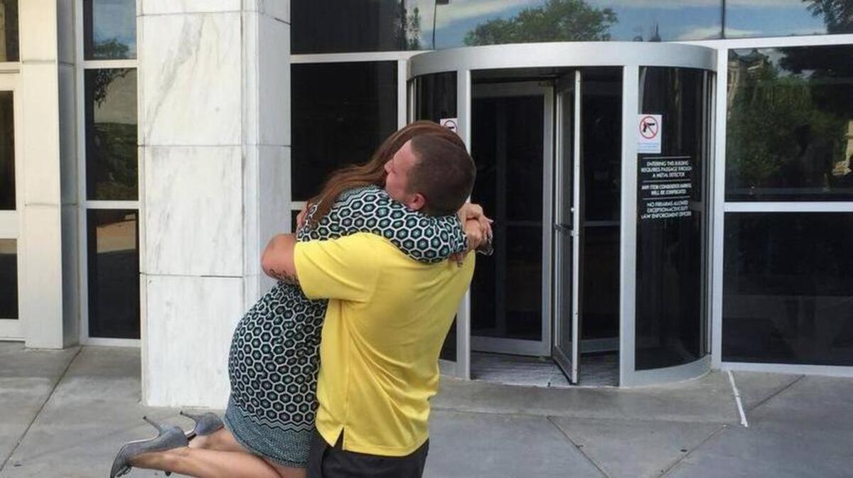 Kyler Carriker hugs his attorney after being acquitted of murder in 2015. The Kansas Court of Appeals ruled Friday that he won’t have to serve prison time for a connected marijuana conviction.