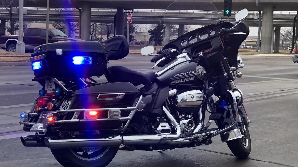 A Wichita Police Department motorcycle cop pulls a driver over on Second at about 9:00 a.m. on Dec. 21.