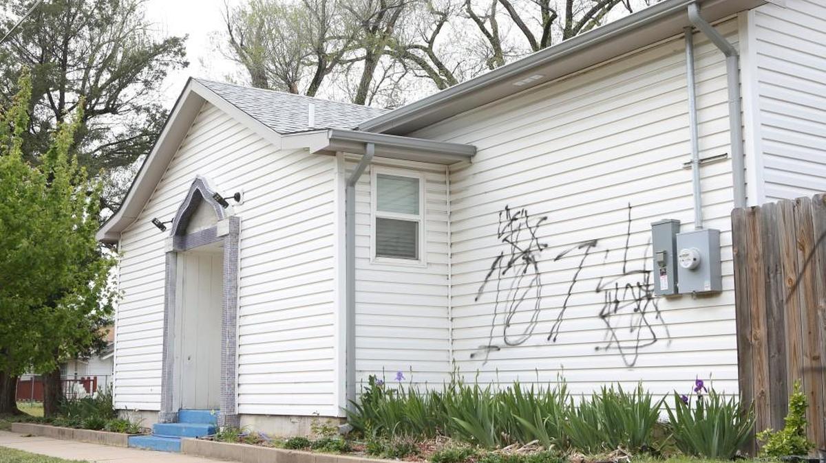 Graffiti mars the side of the Islamic Association of Mid Kansas at 3406 W. Taft. (April 11, 2016)