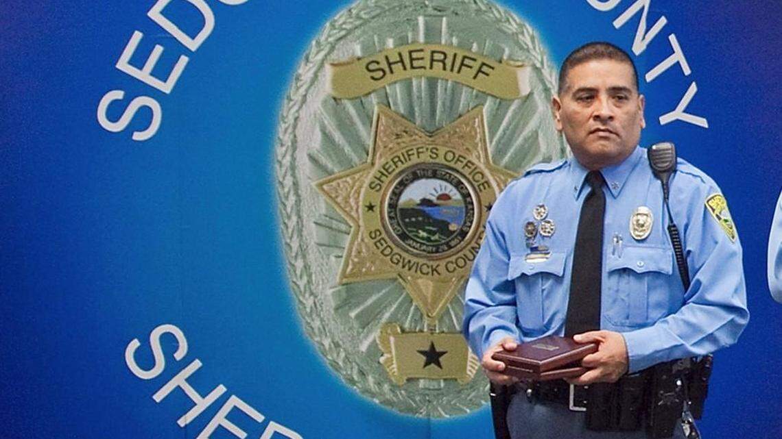Sedgwick County Sheriff’s Deputy Thomas Delgado receives a Carnegie Hero medal for pulling a man from a burning vehicle in 2011. (March 20, 2013)