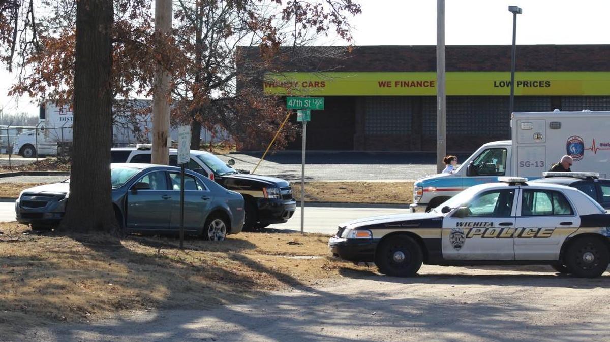 Wichita police clean up after a reportedly stolen car crashed into a tree near 47th and I-135 Monday morning.