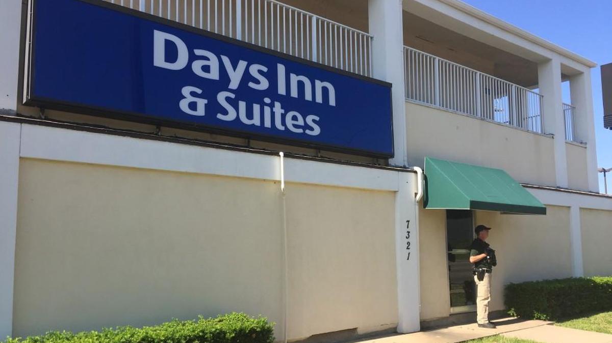 A law enforcement officer stands outside the Days Inn at 7321 E. Kellogg on Monday. (May 29, 2017)