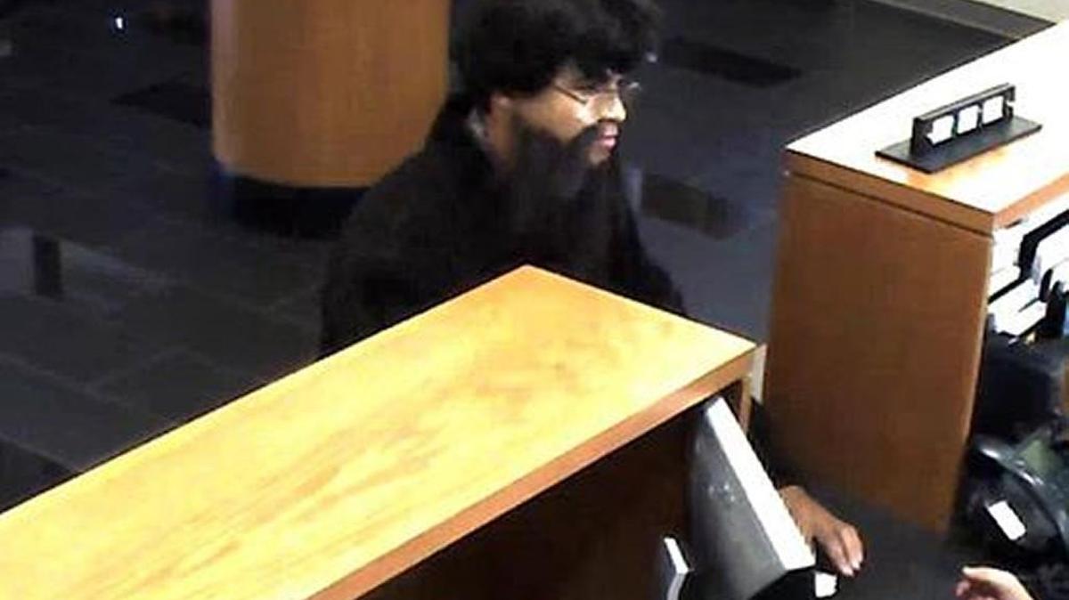 Wichita police released surveillance camera images of a man who is suspected of robbing the Emprise Bank branch on North Broadway on Tuesday afternoon.