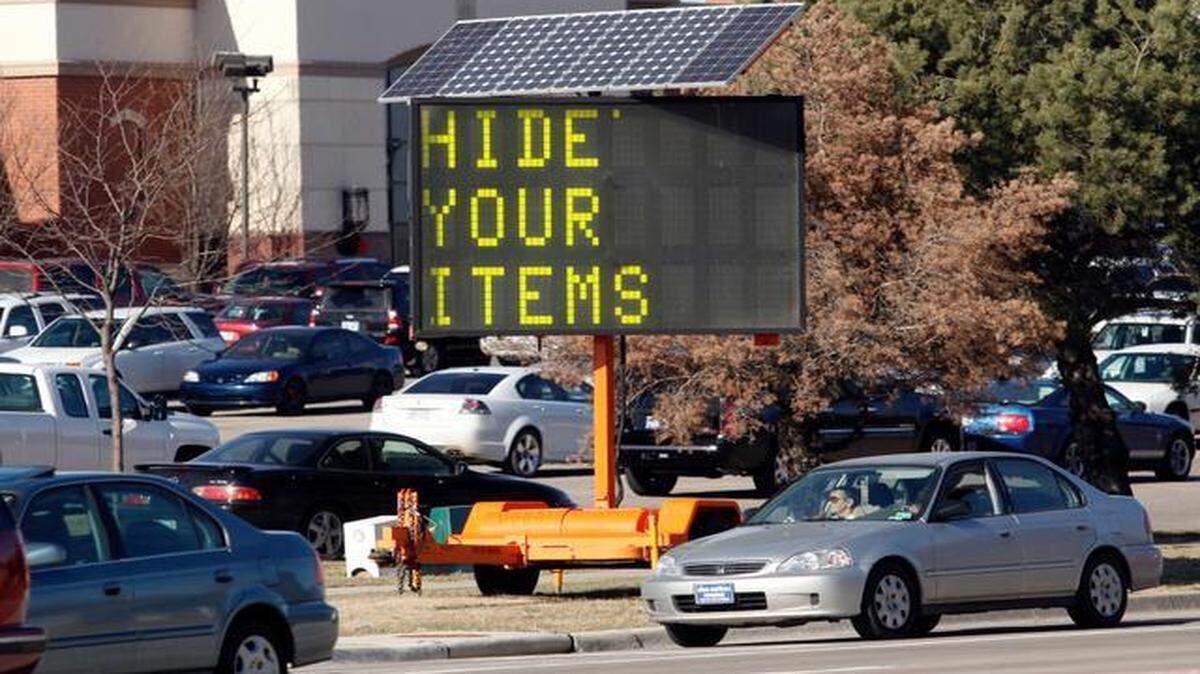 
Signs at Towne East Square remind shoppers to hide valuables, lock their cars and take their keys.
