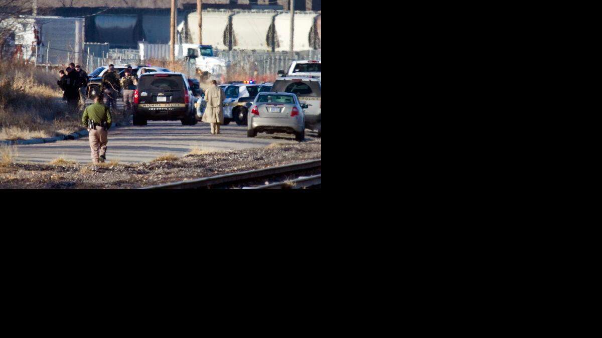 
Wichita police investigate the scene where a body was found on the frontage road south of the Kansas Humane Society, near Hillside and K-96 shortly before 9 a.m. on Jan 16, 2013.
