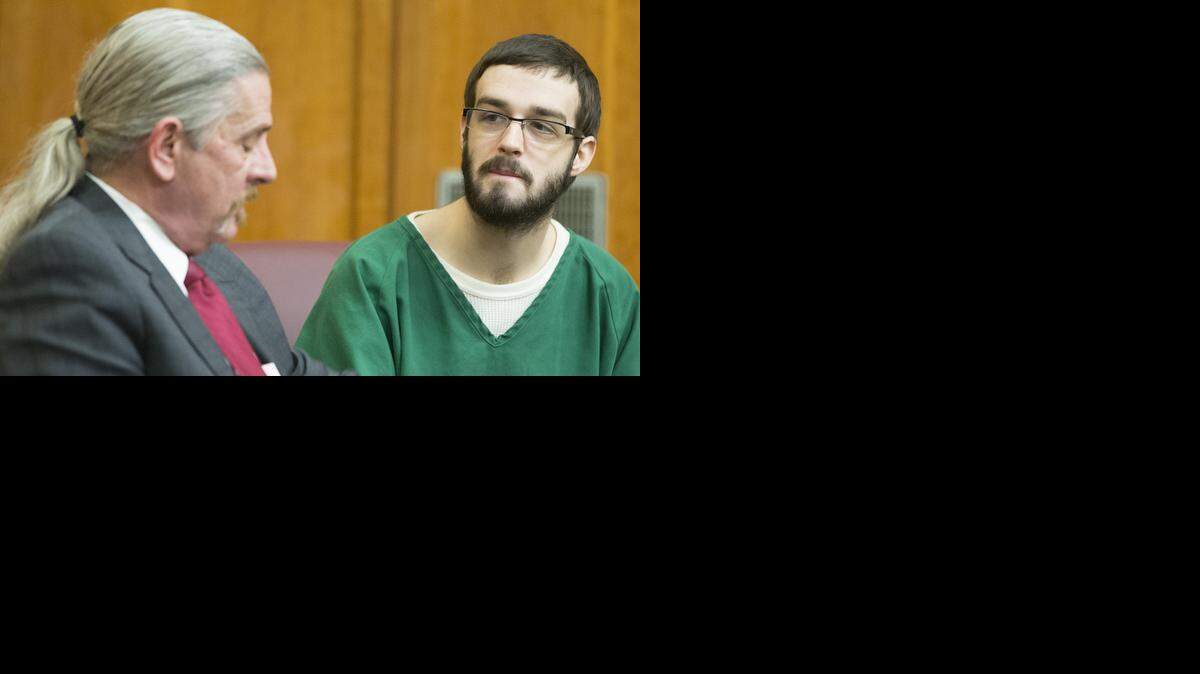 
Andrew Ellington visits with his attorney before a hearing in February at the Sedgwick County Courthouse. Ellington and three other people are charged with capital murder in the deaths of Roger and Melissa Bluml.
