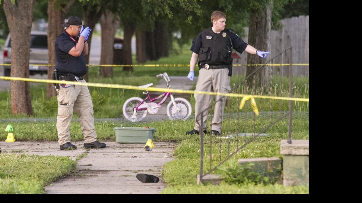 
Wichita police investigate the scene Monday morning where a 31-year-old woman was struck by a car in what was initially described as a hit-and-run on Pattie, just south of Pawnee, around 9 p.m. Sunday night. (May 18, 2015)

