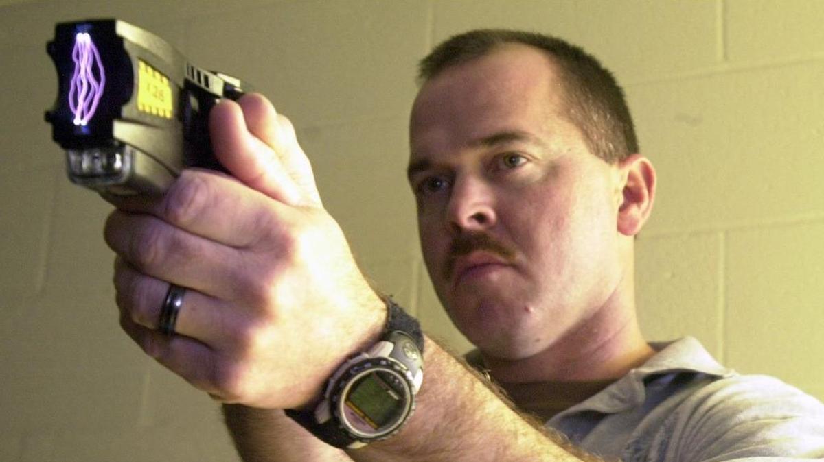 Wichita police Lt. Kevin Vaughn demonstrates a Taser gun in 2005.
