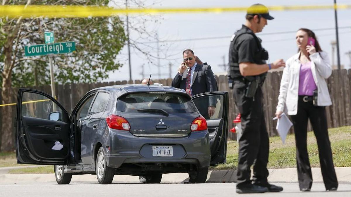 Police investigate the fatal shooting of an 18-year-old man near the corner of Courtleigh and Orme on Monday afternoon. (April 3, 2017)
