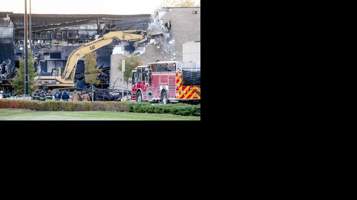 
On Friday, demolition crews knock down part of the FlightSafety building that a small airplane crashed into Thursday. Federal investigators hope to begin recovering evidence inside the building Saturday. (Oct. 31, 2014)
