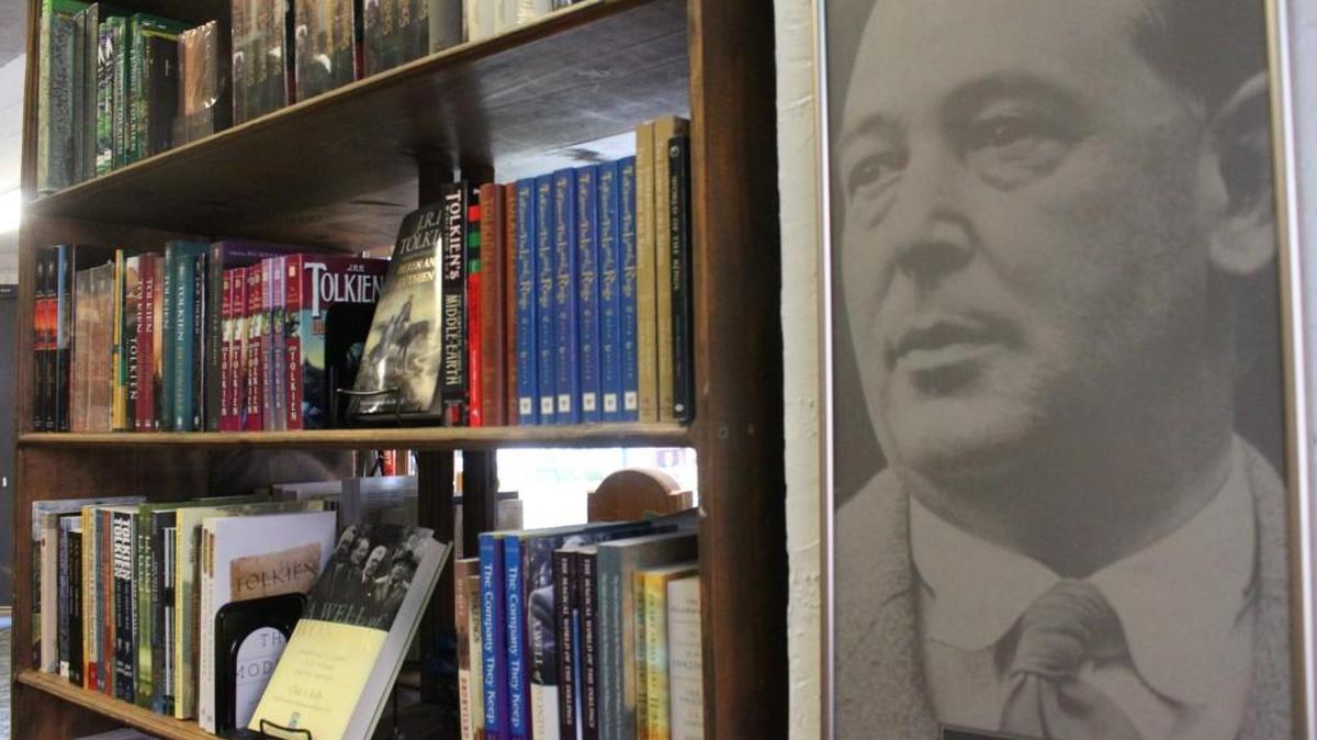 A portrait of C.S. Lewis hangs next to the ‘C.S. Lewis and friends’ section in Eighth Day Books.