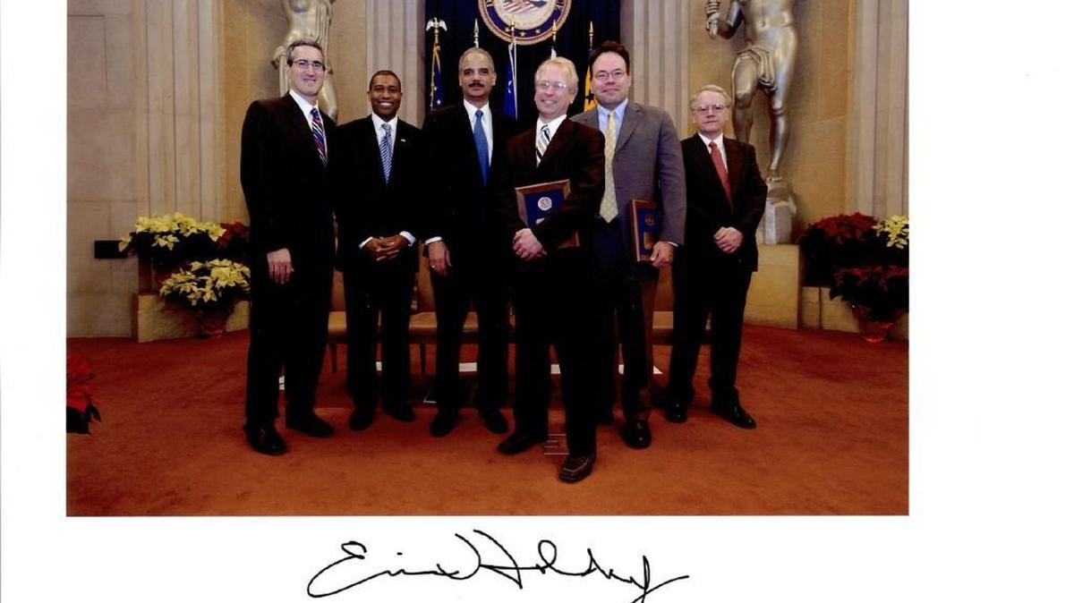 Wichita East High graduate August Flentje, third from right, received an award from Attorney General Eric Holder under the Obama administration. Flentje is arguing on behalf of President Donald Trump on Tuesday at the 9th Circuit Court of Appeals that Trump’s executive order to bar immigrants from seven predominantly Muslim countries is legal.