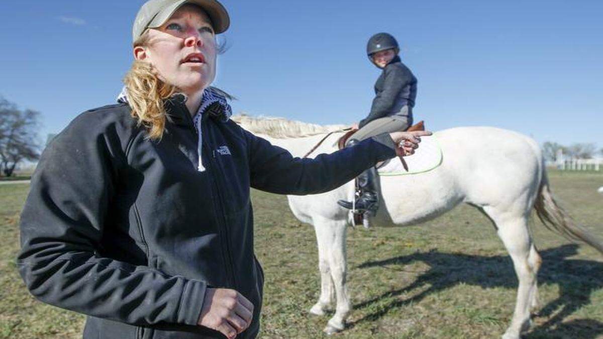 
Equestrian coach Dehlia Burdan gives instructions to Independent junior Samantha Stephens during a coaching session at Aces High Acres in Derby on Thursday. (April 9, 2015)
