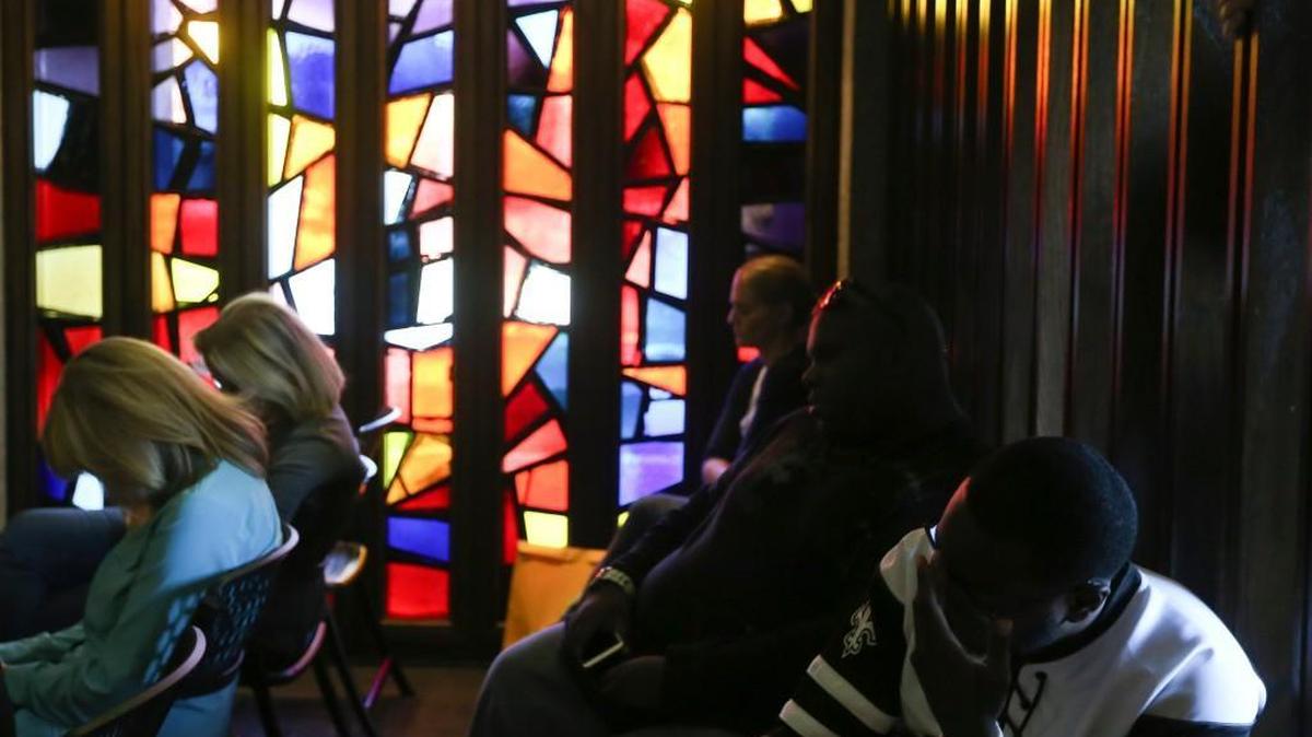 Wichita State students, faculty and alumni sit in prayer during an event called Prayers with the President at Grace Memorial Chapel on Oct. 16.