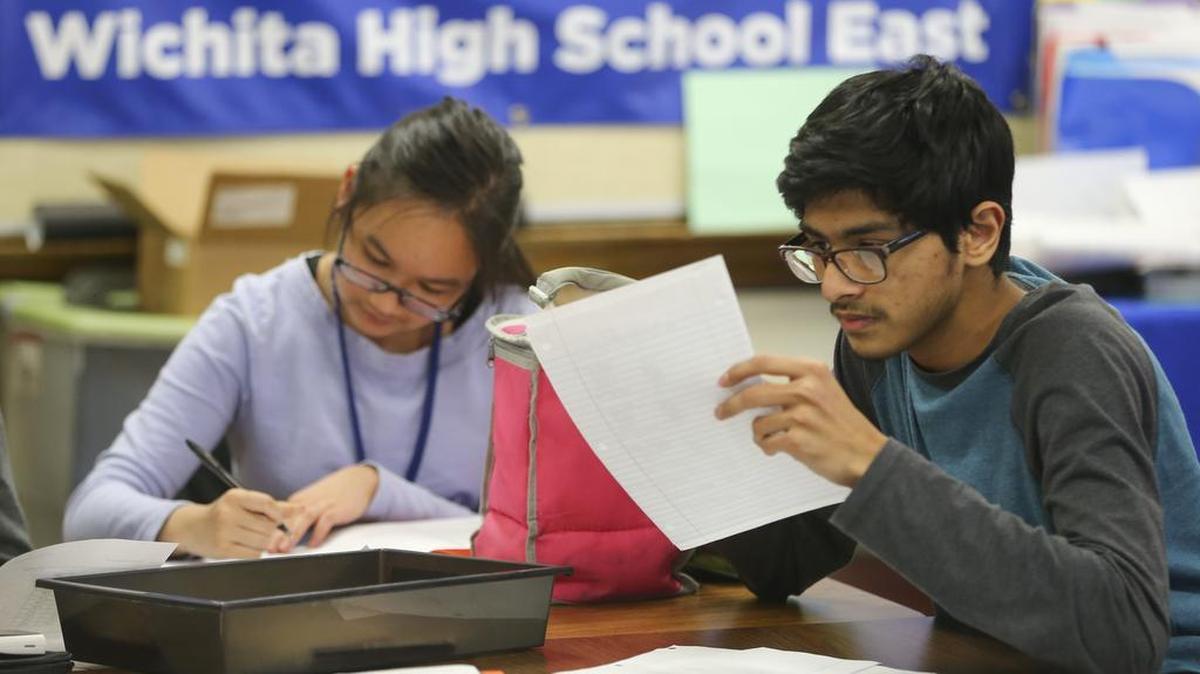 Syed Shamiun, right, and Vivian Pham take part in an International Baccalaureate course at East High. A bill in the Kansas Legislature would do away with IB and Advanced Placement courses in public schools. (Feb. 18, 2016)