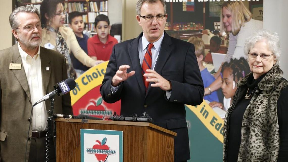 School board member Lynn Rogers, left, Wichita schools superintendent John Allison, and board president Sheril Logan at a news conference in March on school funding.