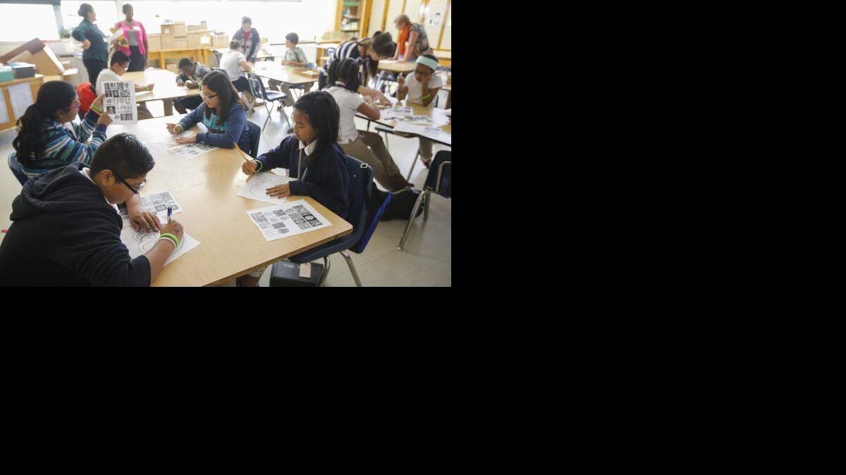 
Kids work on art projects during an after-school program at Mead Middle School. 
