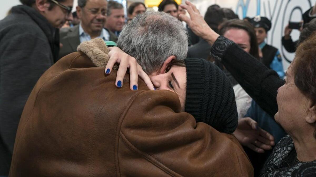 Family members who arrived from Syria are greeted by family at John F. Kennedy International Airport in New York on Feb. 6. Organizers in cities across the U.S. are telling immigrants to skip class, skip work and not shop on Thursday as a way to show the country how important they are to America’s economy and way of life.