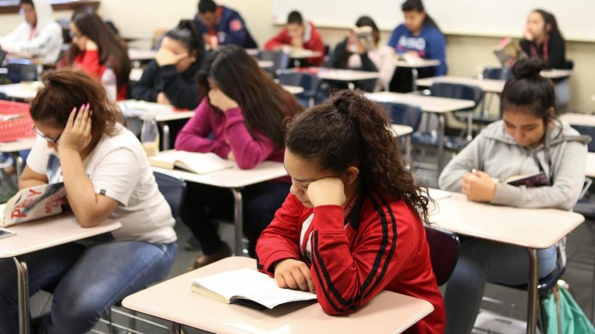 North High freshman Alejandra Hernandez reads during “Tower Time,” a time where the entire school spends half the period reading. District officials will discuss next year’s budget Monday night even though questions remain about state funding.