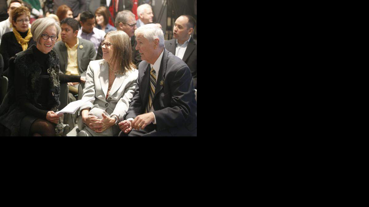 
Liz Koch, left, talks with Wichita State University president John Bardo and his wife, Deborah, before a news conference announcing that Koch Industries and the Fred and Mary Koch Foundation are giving $11.25 million to WSU. It’s the largest single-time gift in university history. 
