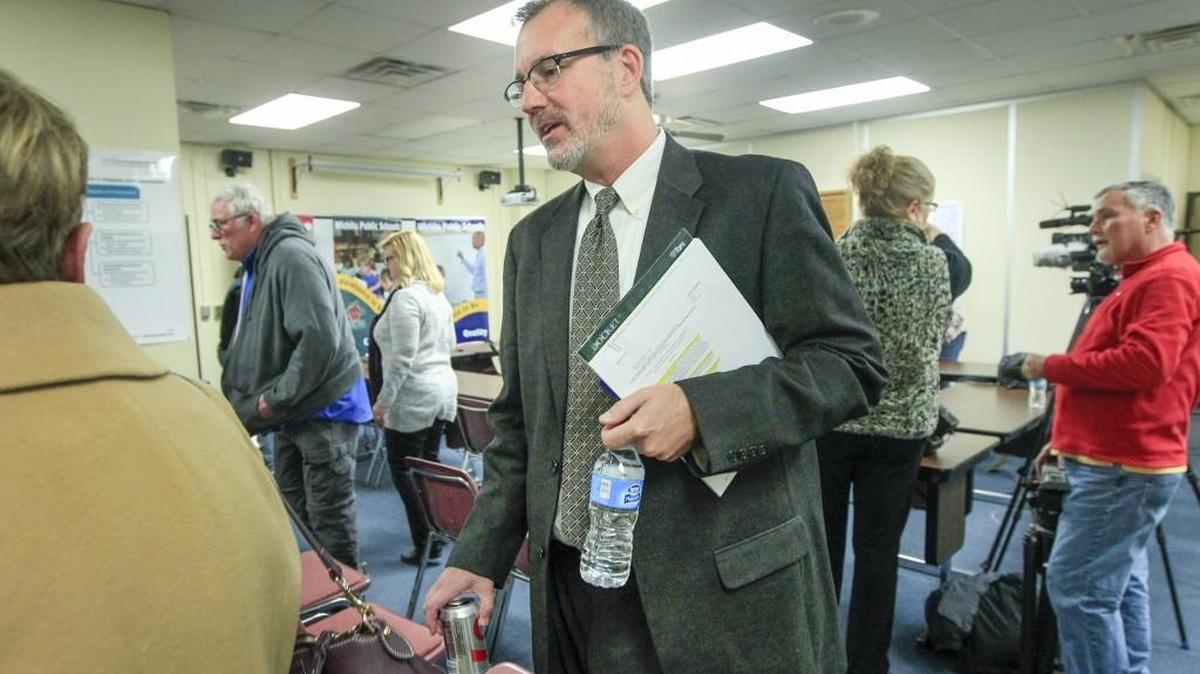 Wichita school superintendent John Allison leaves a special school board meeting in January. (Jan. 5, 2017)
