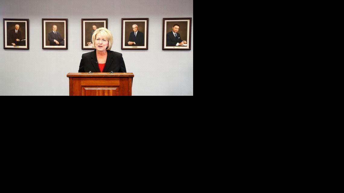
Standing before portraits of some of her predecessors, Amy Bragg Carey speaks at the announcement of her presidency Friday at Friends University.
